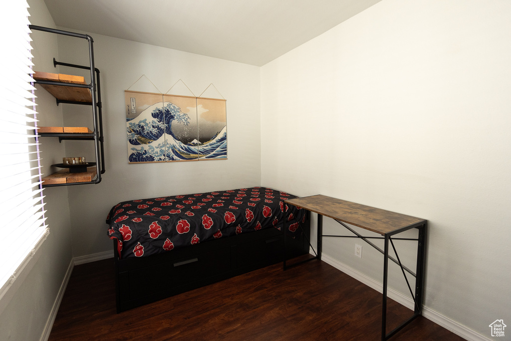 Bedroom featuring dark hardwood / wood-style flooring