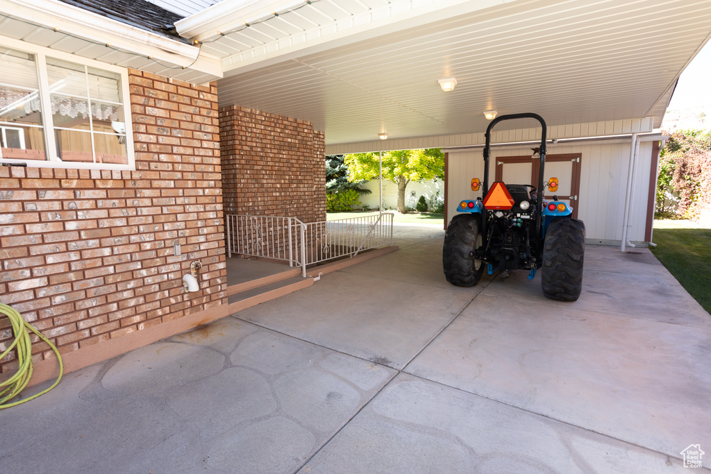 View of patio / terrace with a carport