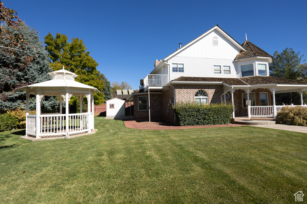 Exterior space with a yard and a gazebo