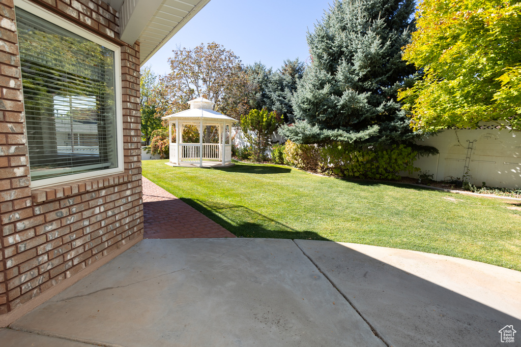 View of yard featuring a gazebo and a patio area