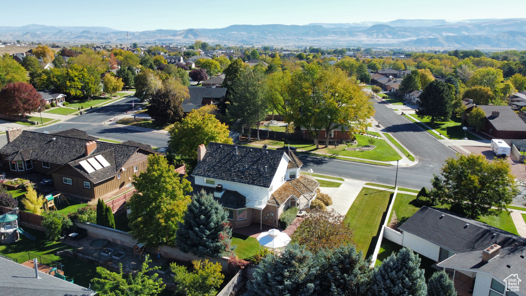 Birds eye view of property with a mountain view