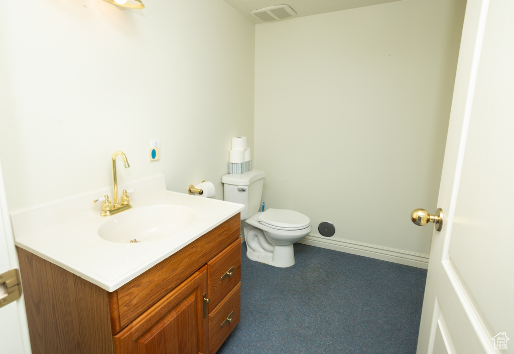 Bathroom featuring toilet and vanity