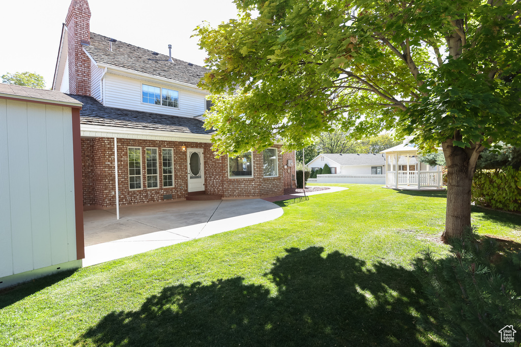 View of yard with a patio area