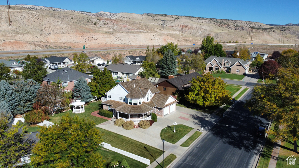 Birds eye view of property with a mountain view