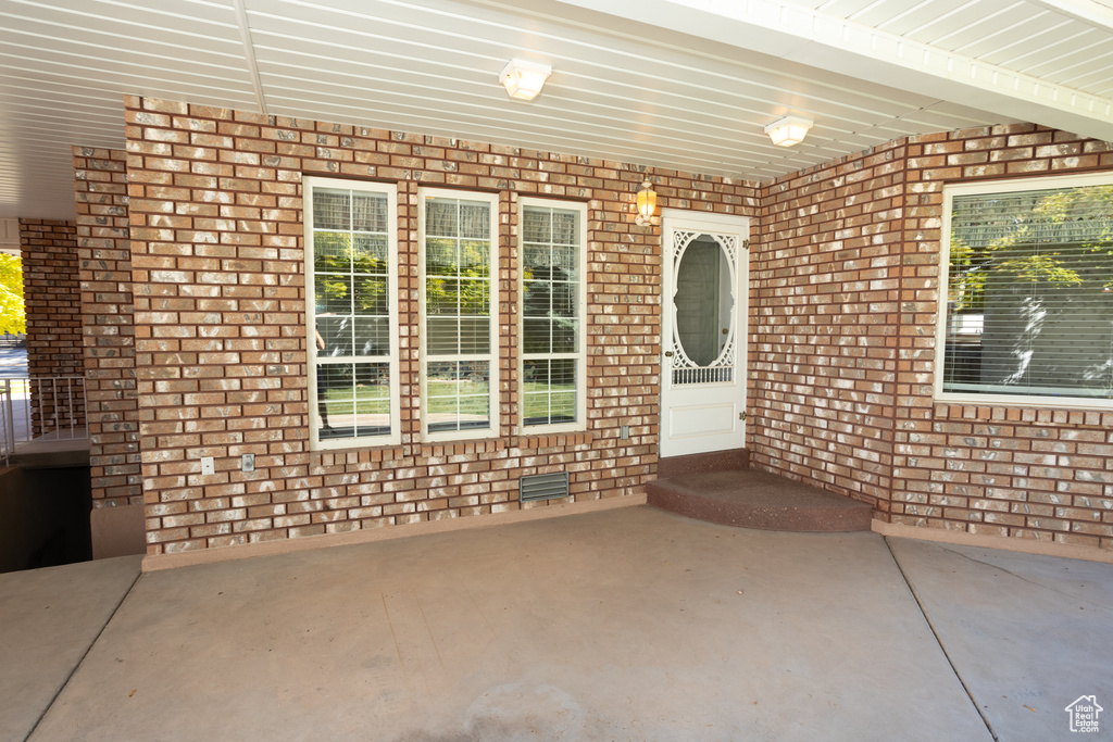 Entrance to property featuring a patio