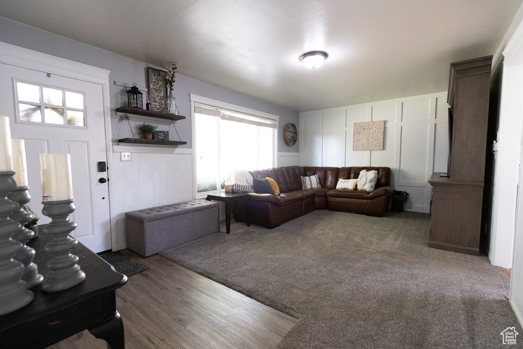 Carpeted living room with a wealth of natural light