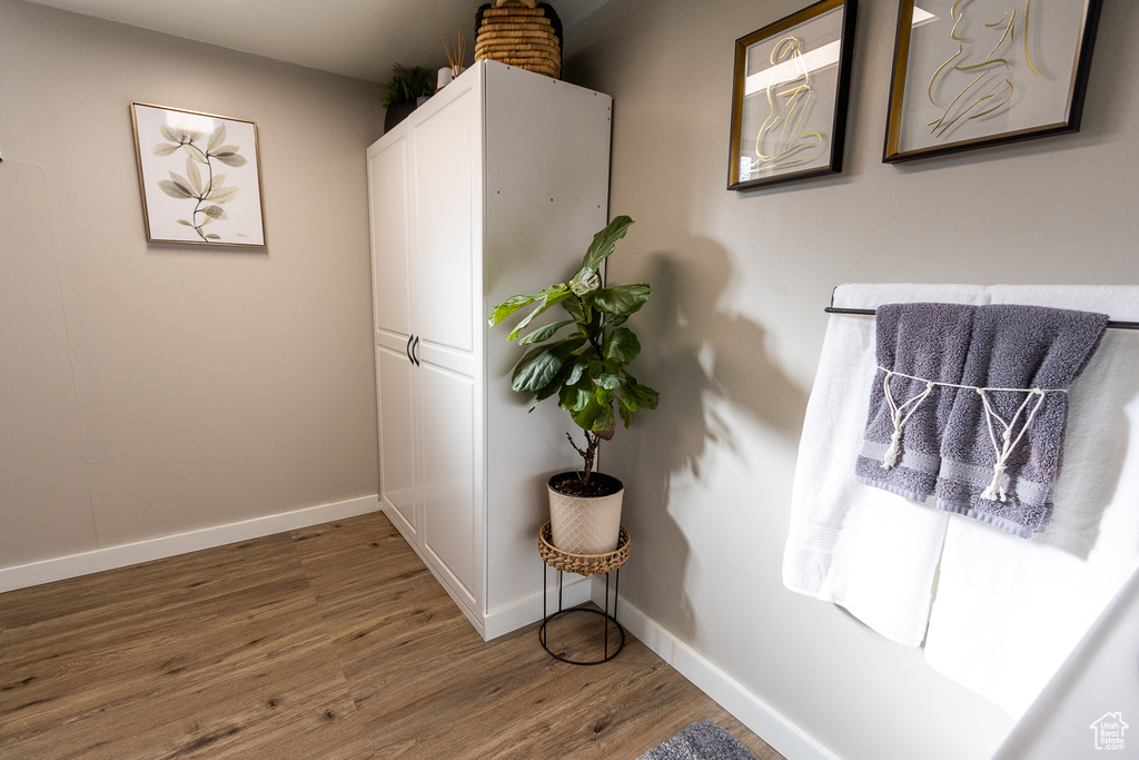 Hall with dark wood-type flooring