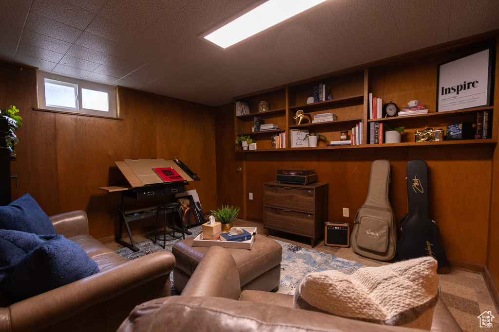 Living room featuring wood walls