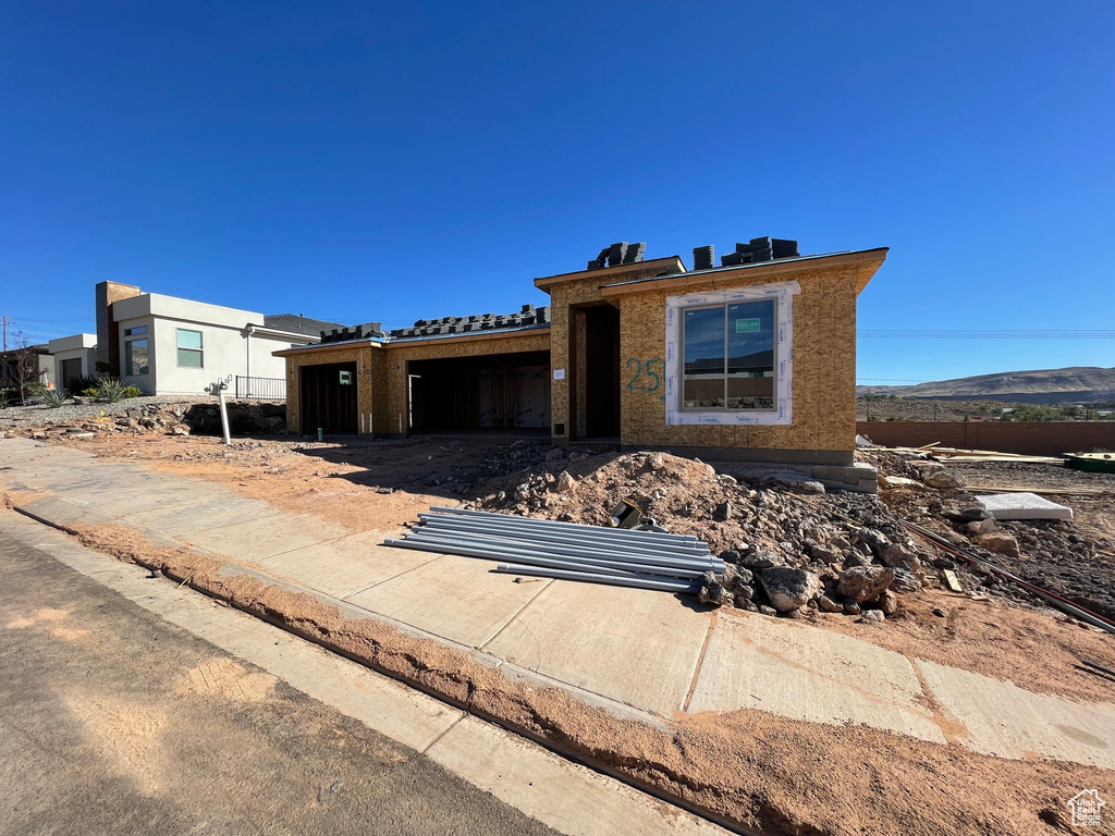 Property in mid-construction featuring a mountain view