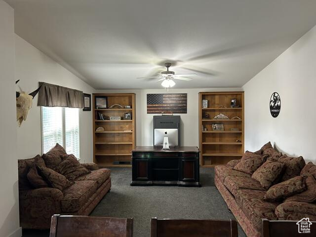 Living room featuring ceiling fan