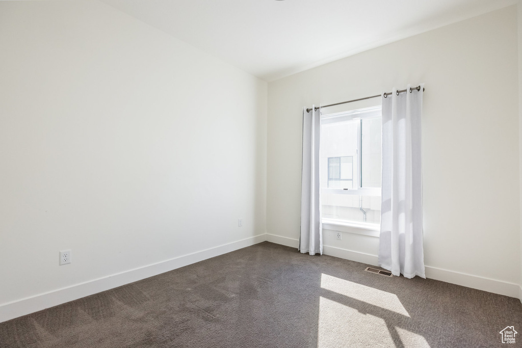 Empty room featuring carpet