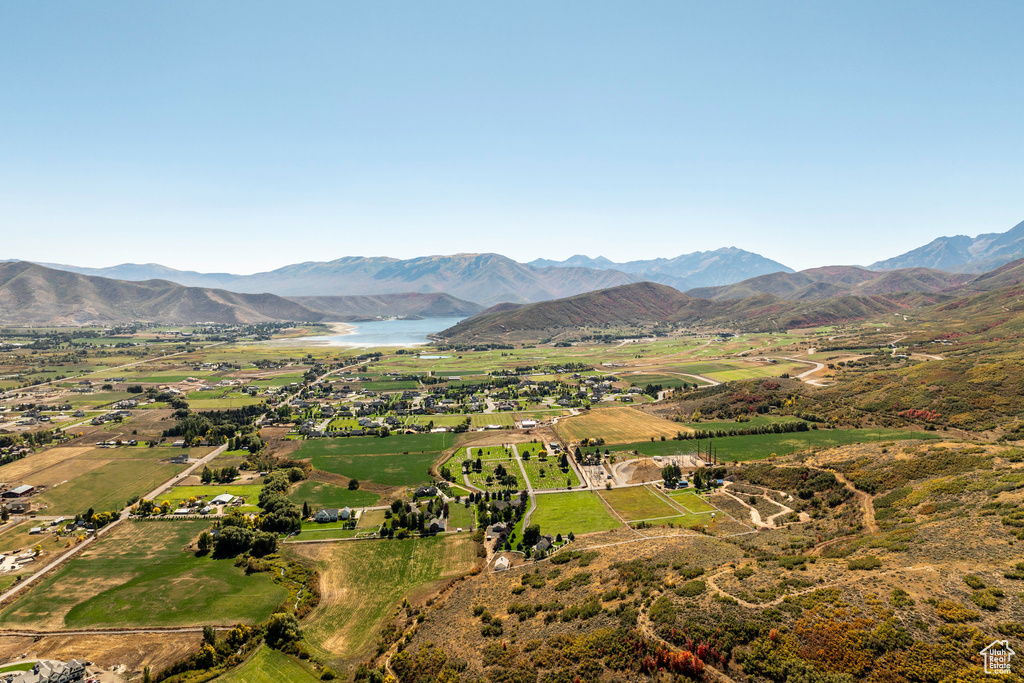 Property view of mountains with a water view