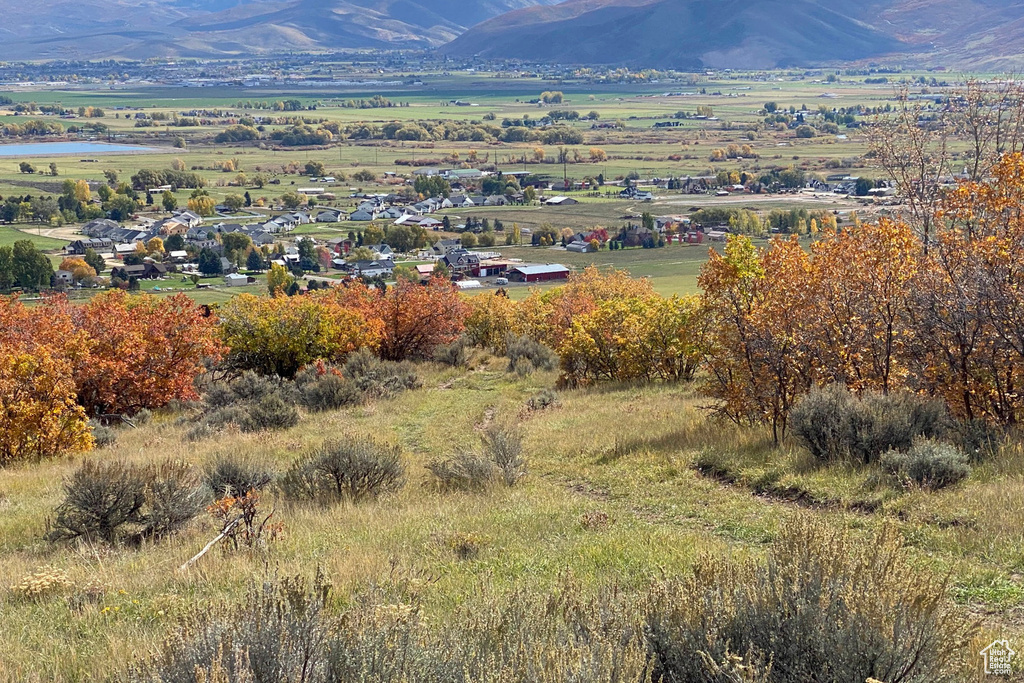 Property view of mountains with a rural view