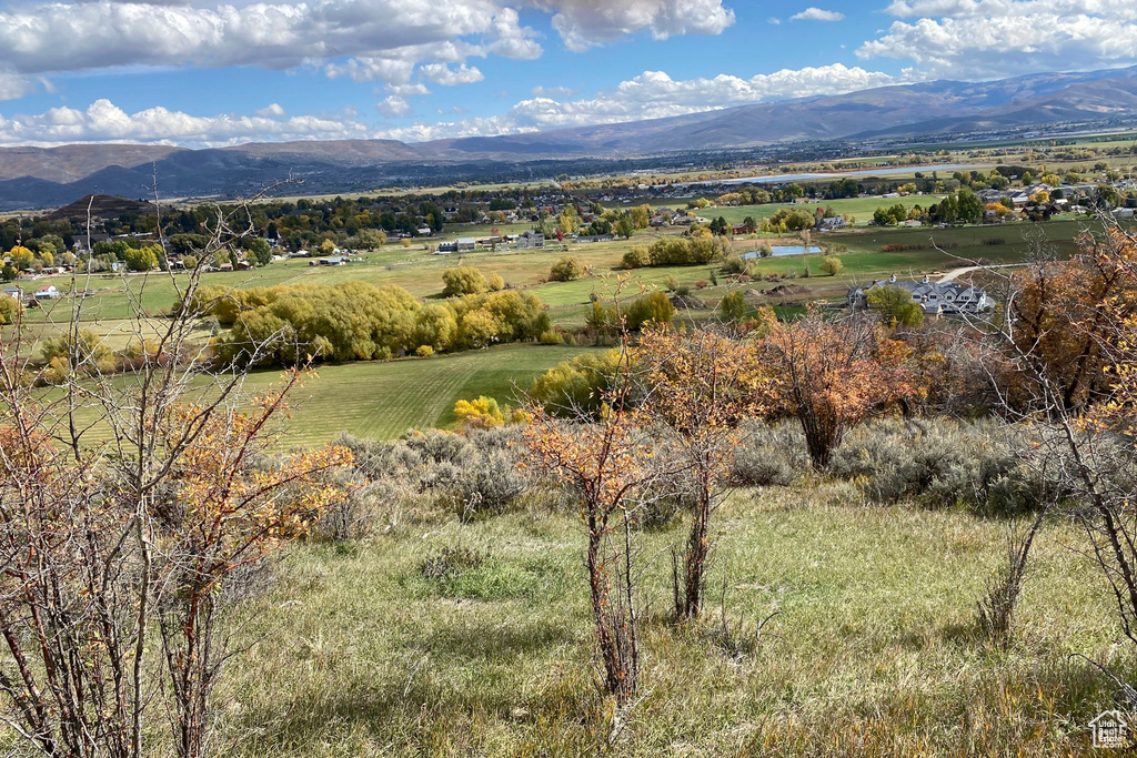 Property view of mountains with a rural view