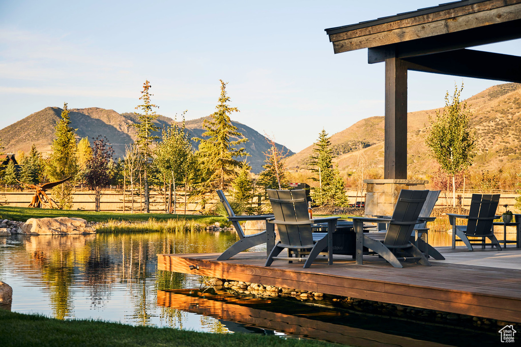 Exterior space featuring a water and mountain view