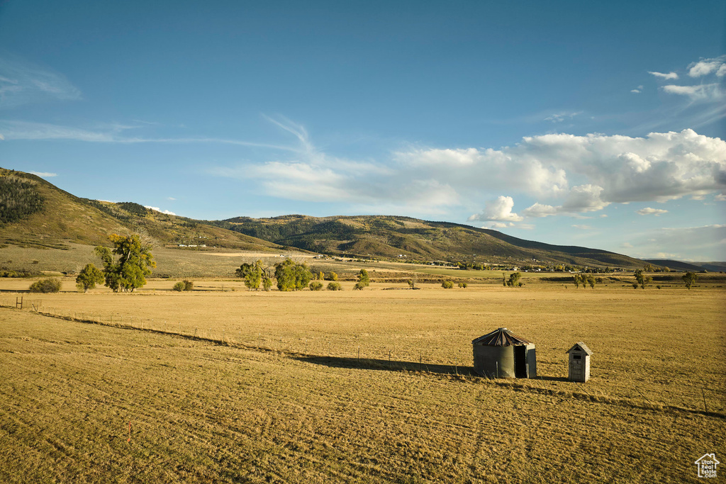 Property view of mountains with a rural view