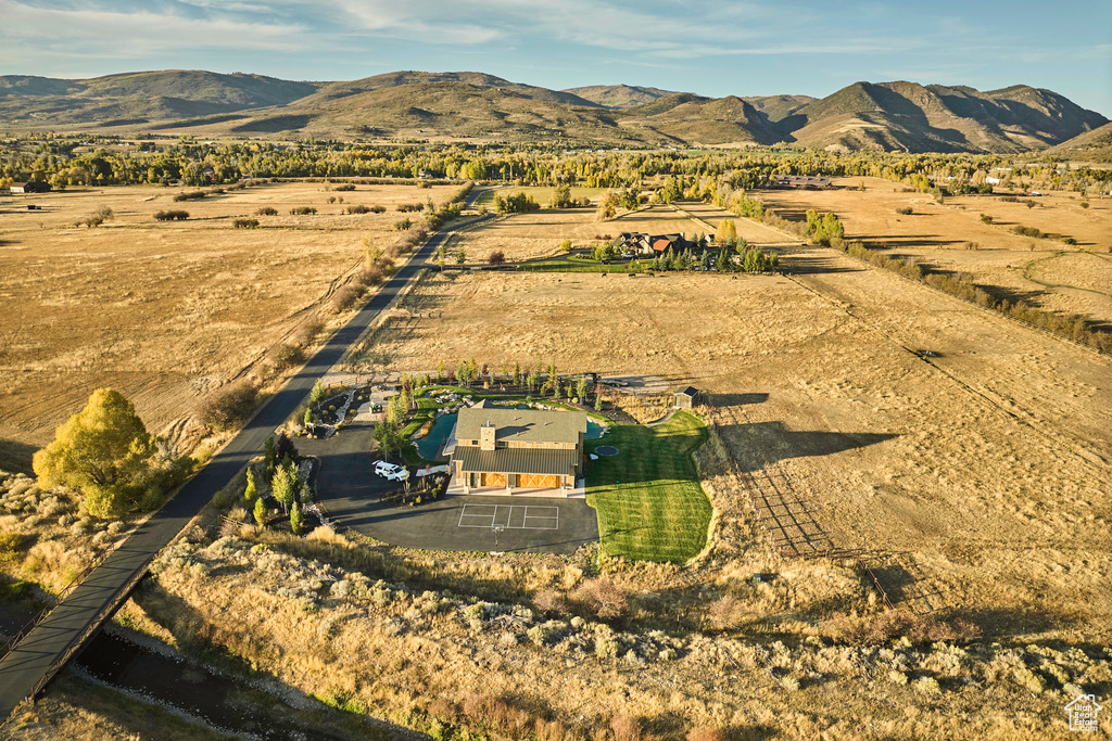 Birds eye view of property with a mountain view and a rural view