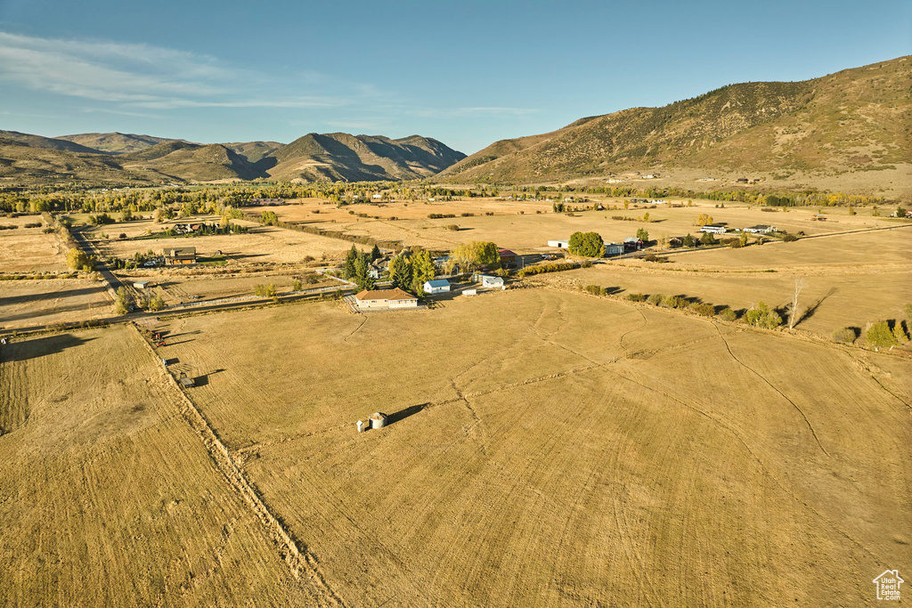 Birds eye view of property featuring a mountain view and a rural view