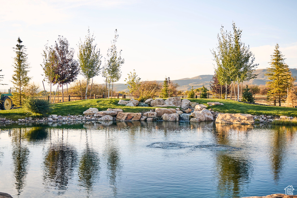 View of water feature with a mountain view