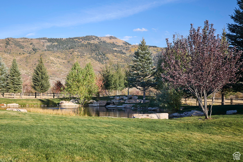 View of mountain feature featuring a water view and a rural view