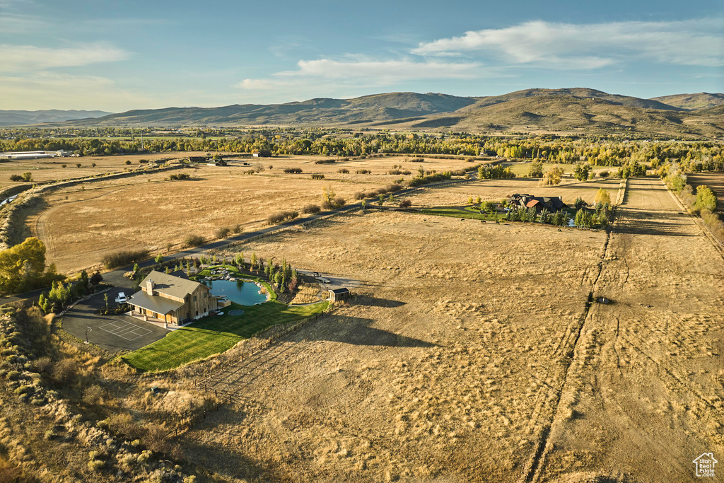 Birds eye view of property with a mountain view and a rural view