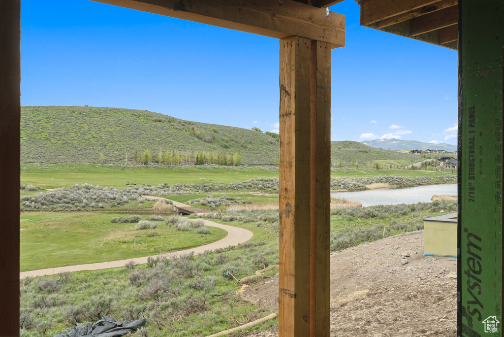 View of yard featuring a water and mountain view