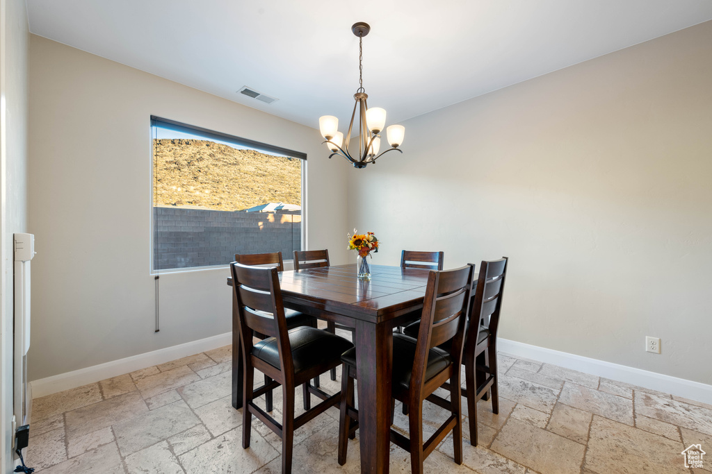 Dining area with an inviting chandelier