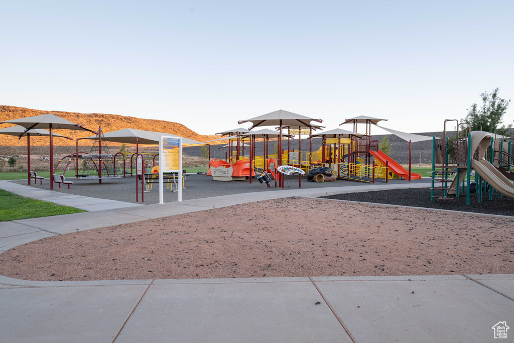 View of jungle gym featuring a mountain view