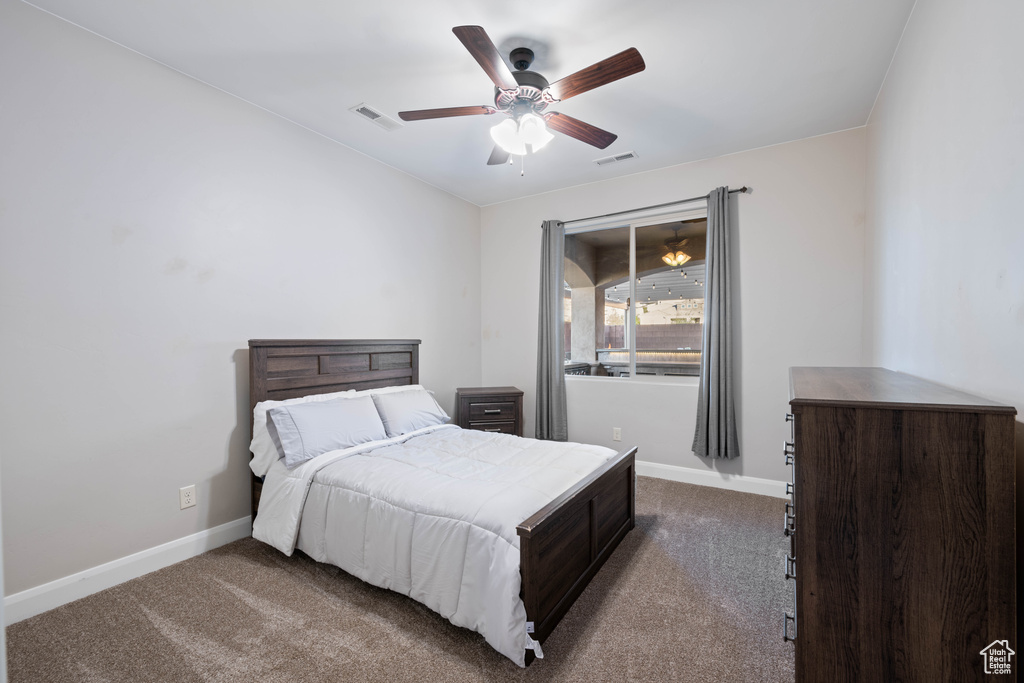 Bedroom with carpet flooring and ceiling fan