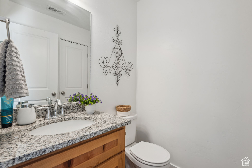 Bathroom with toilet and vanity