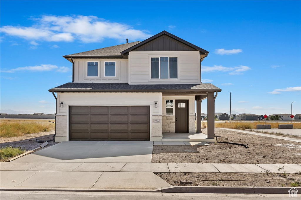 View of front of home featuring a garage