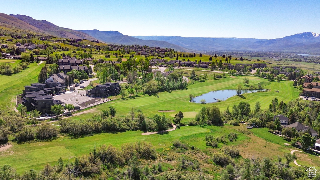 Aerial perspective of suburban area featuring a water and mountain view and a local golf course