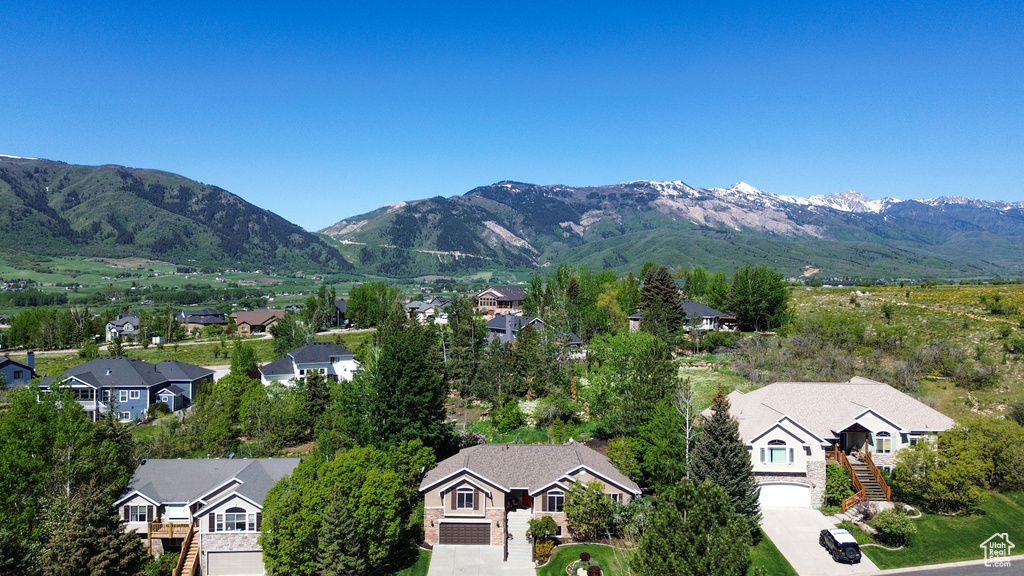 View of mountain backdrop featuring nearby suburban area