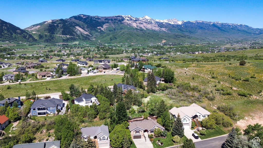 Aerial view of residential area featuring mountains