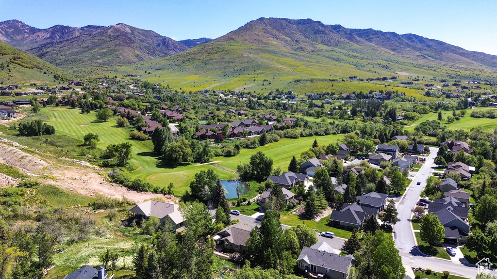 View of property location with nearby suburban area, a mountainous background, and a golf course