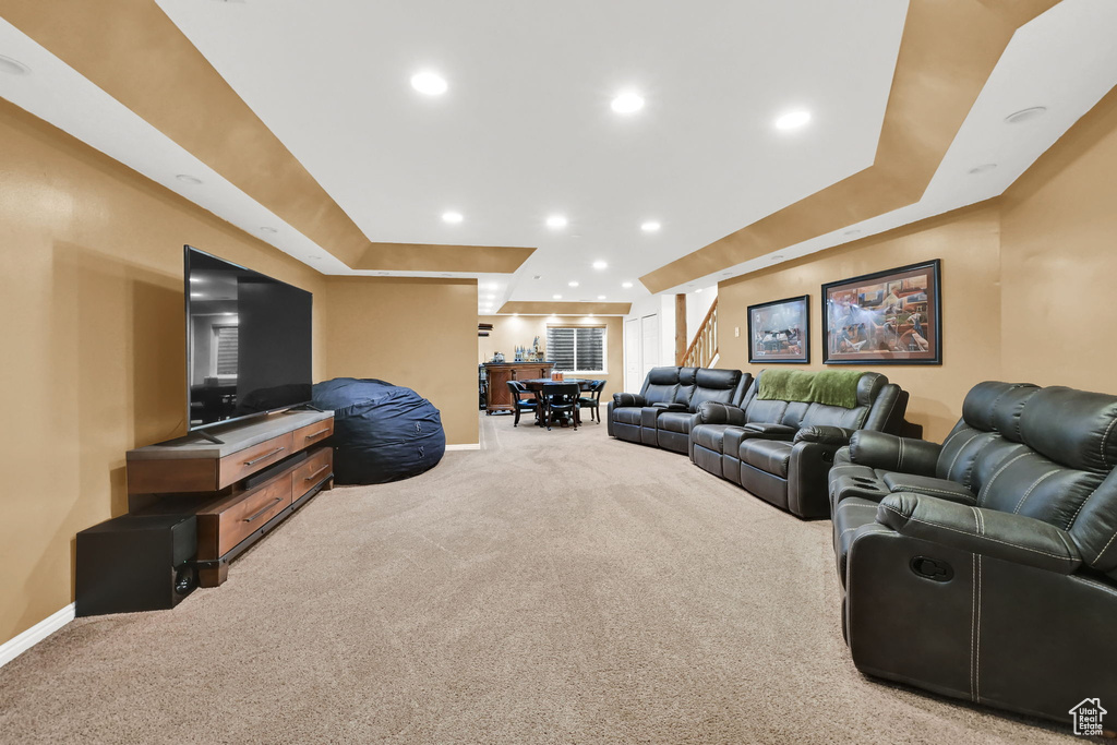 Living area with baseboards, carpet flooring, and recessed lighting