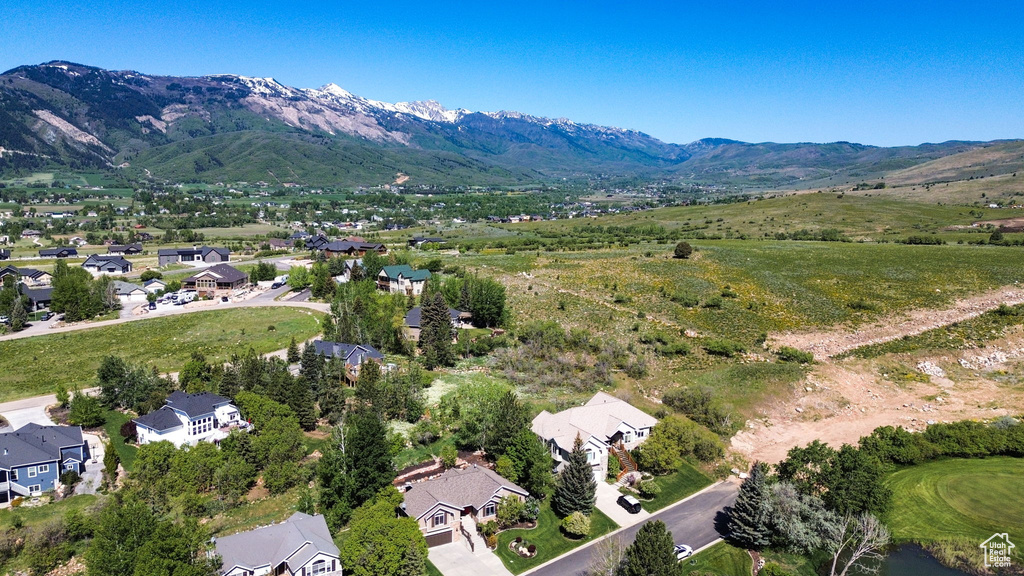 Aerial view of residential area featuring mountains