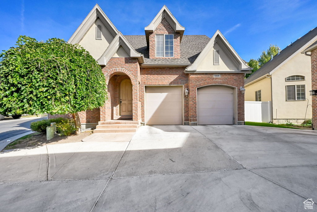 View of front of property with a garage