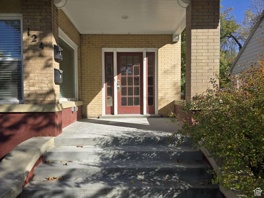 Property entrance with covered porch