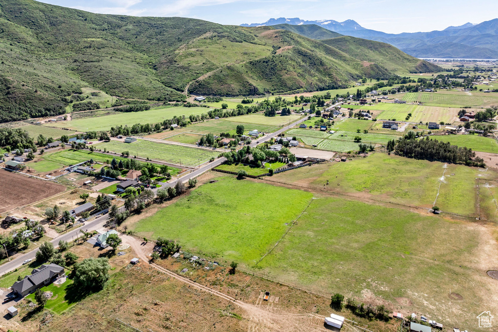 Birds eye view of property with a mountain view and a rural view