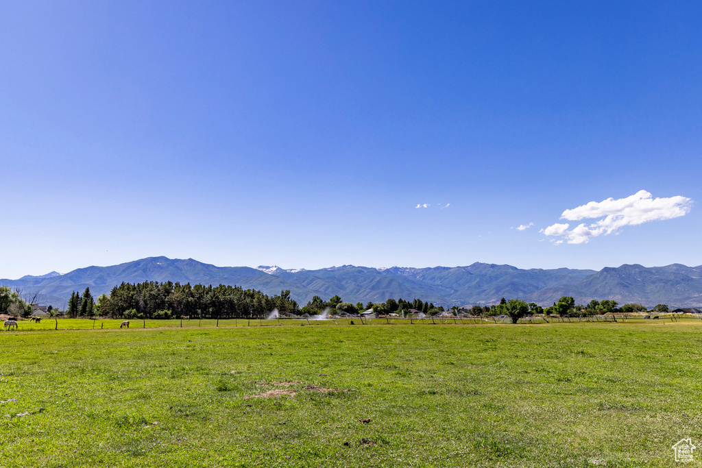 Property view of mountains featuring a rural view