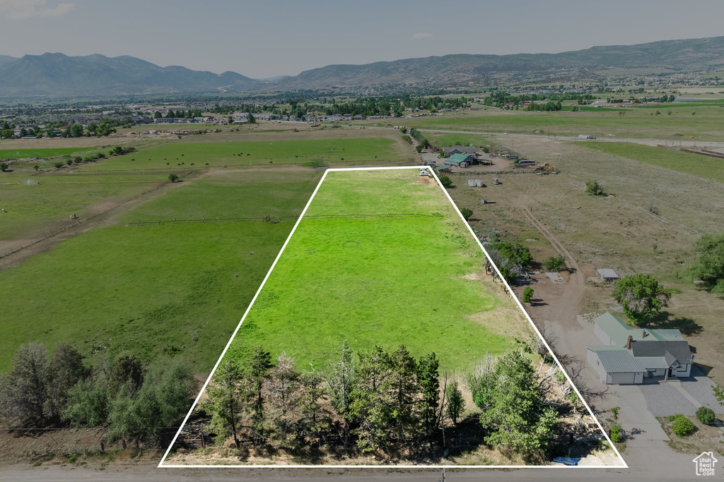 Birds eye view of property featuring a mountain view and a rural view