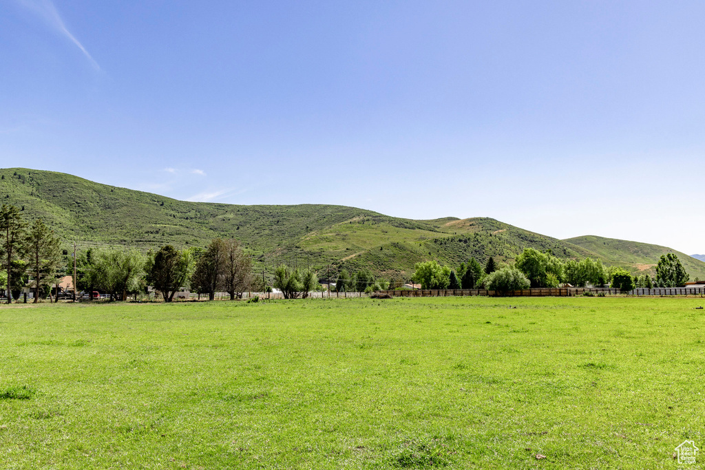 Property view of mountains with a rural view