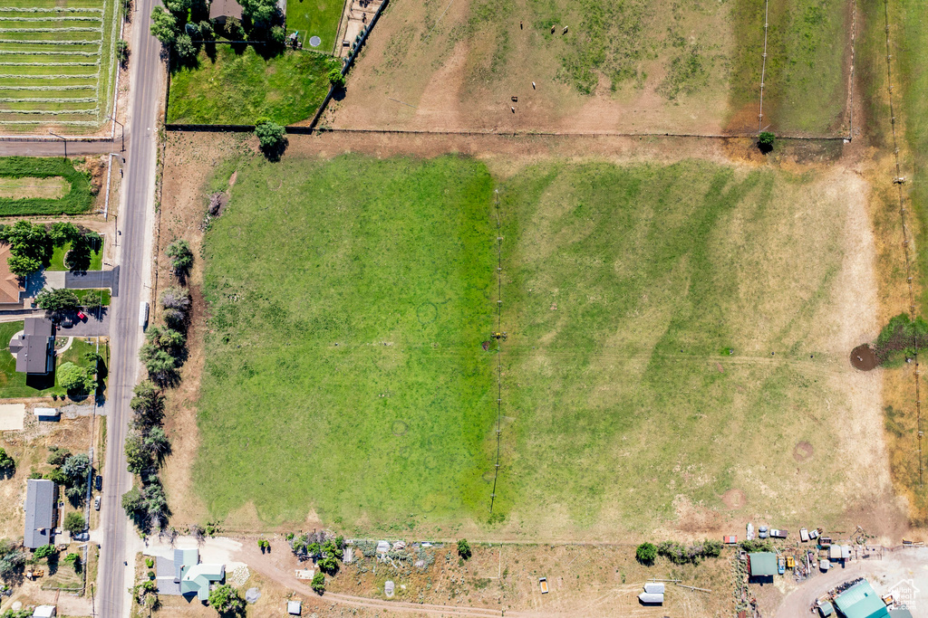 Birds eye view of property featuring a rural view