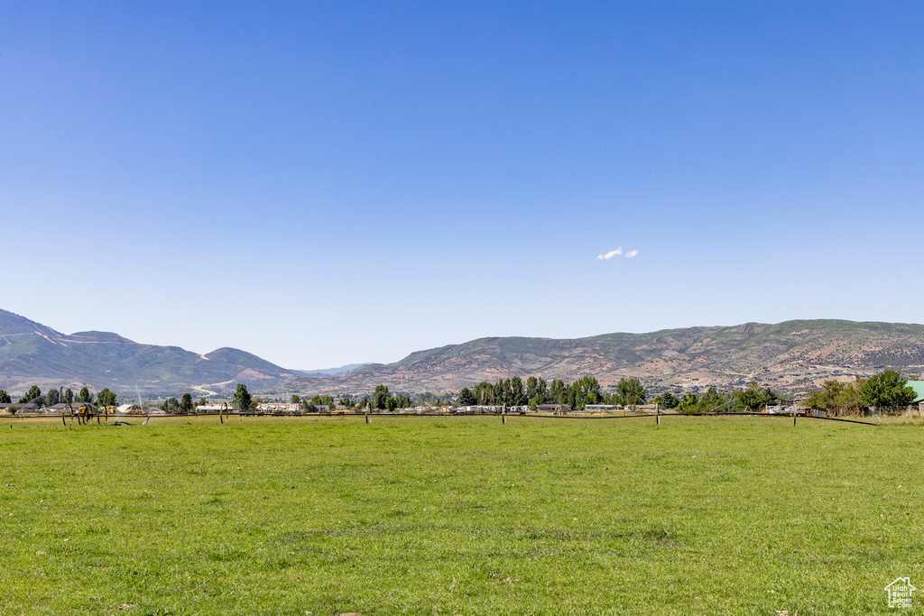 Property view of mountains with a rural view