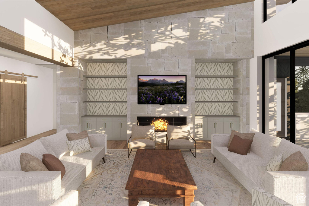 Living room featuring wood ceiling, high vaulted ceiling, a barn door, and light hardwood / wood-style floors