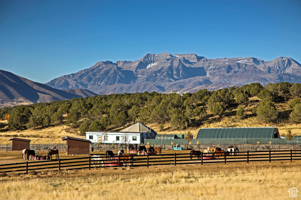 Property view of mountains with a rural view