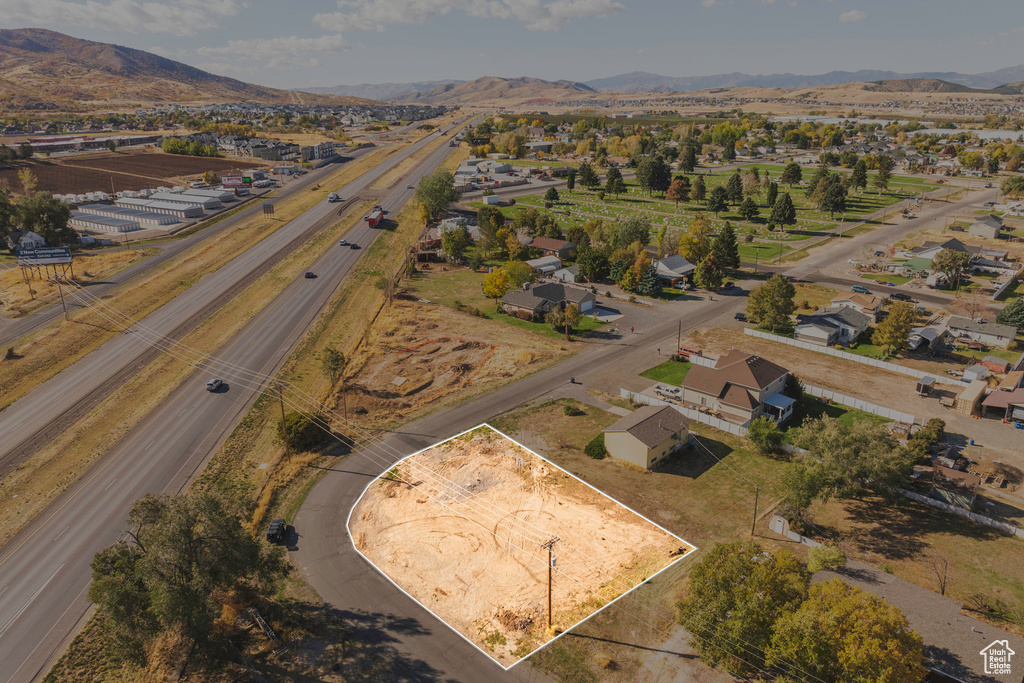 Birds eye view of property with a mountain view