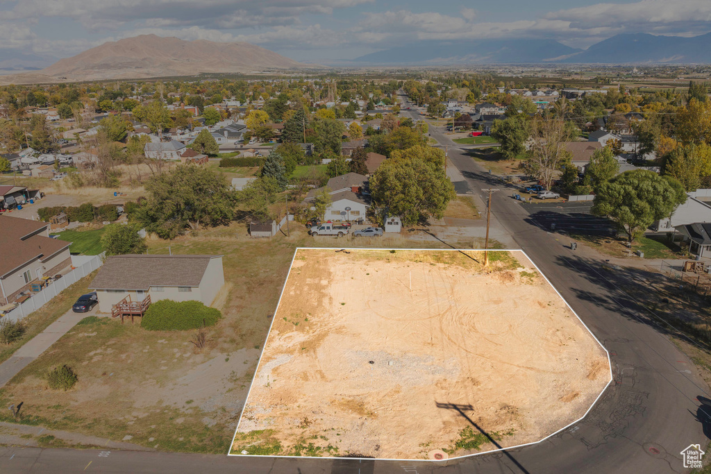 Birds eye view of property with a mountain view