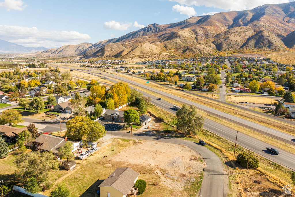 Birds eye view of property with a mountain view